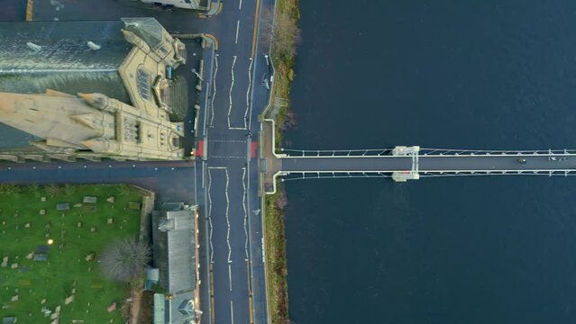 Flying above Grieg Street bridge across the River Ness from Old High Church Inverness