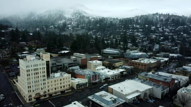 Ashland, Oregon, USA, Winter 2023.  Downtown. Moving West over downtown with Ashland Springs Hotel to the leftand moving towards the Oregon Shakespeare Festival.