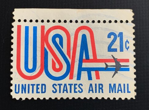 Bari, Italy - November 10, 2023 A 21 cent United States Airmail postage stamp shows image of Jet and text USA in red white and blue, circa 1973.
