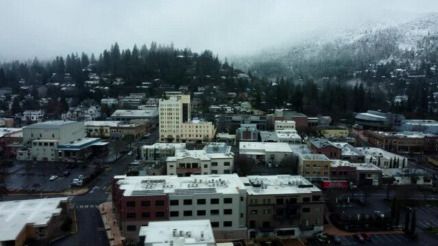 Ashland, Oregon, USA, Winter 2023.  Downtown. Moving from East to West looking South at downtown.  Showing Ashland Springs Hotel, and the OSF Elizabethan Theater, and the Plaza