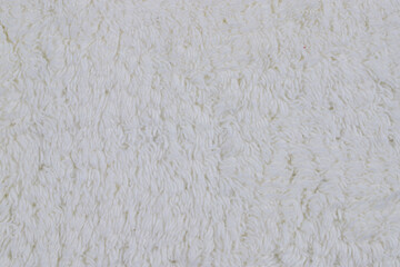 bath mat with pile and lace trim, hand-knitted, isolated 