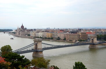 Fototapeta na wymiar Budapest, B, Hungary - August 18, 2023: Skyline with Parliament Building and Bridge of chains over Danube River