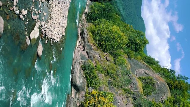 The Bolshaya Laba River. A mountain emerald river in a narrow, sunlit canyon. Bolshaya Laba River near the village of Psemen in Karachay-Cherkessia, Russia. Panoramic view. 4K