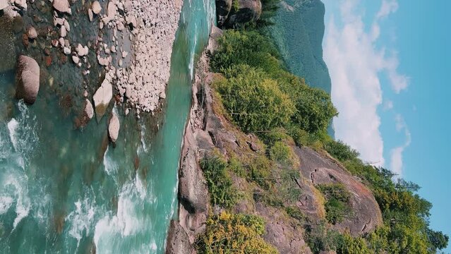 The Bolshaya Laba River. A mountain emerald river in a narrow, sunlit canyon. Bolshaya Laba River near the village of Psemen in Karachay-Cherkessia, Russia. Panoramic view. 4K