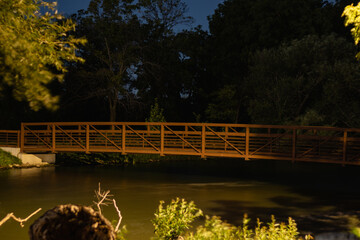 bridge in over a canal at night