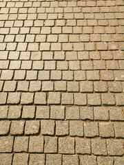 Paving stones on the road as an abstract background. Texture