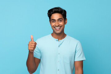 young indian man showing thumbs up