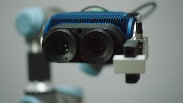 A Robot Arm moving around picking up small bricks