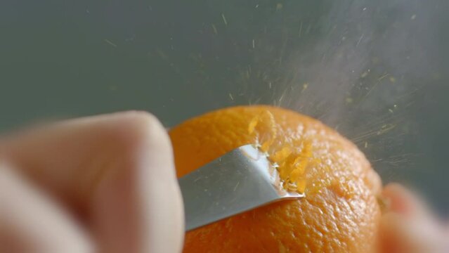 Close-up of Orange Zest Being Grated With a Zester