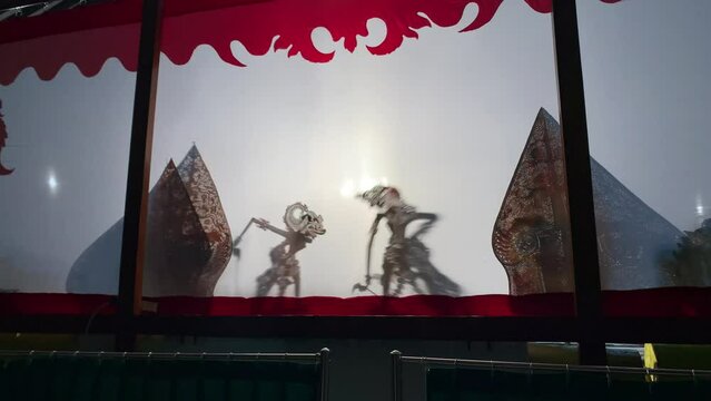 Silhouette of javanese wayang kulit or shadow puppets from Java, Indonesia puppet show by puppeteer