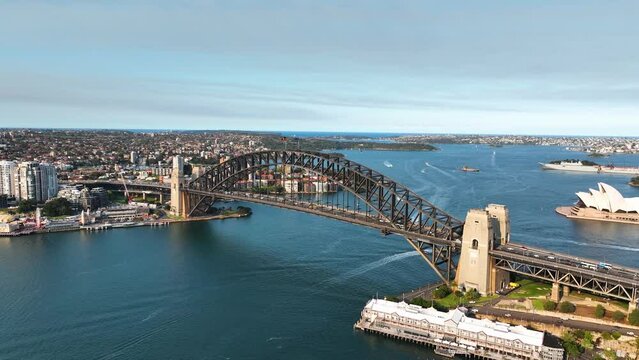 Stunning Aerial View Of Sydney Harbour, Panning From Harbour Bridge And Opera House To Reveal North Sydney at Sunset, Australia.