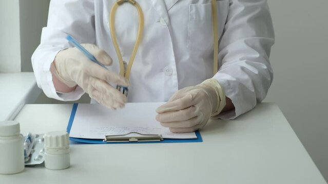 Female doctor consulting patient about pills. Physician prescribing medicine sitting at the desk in clinic office. Healthcare, medical and pharmacy industry concept