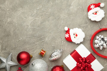 Christmas headband Santa Claus head design with white gift with red bow on blue background. Space for text