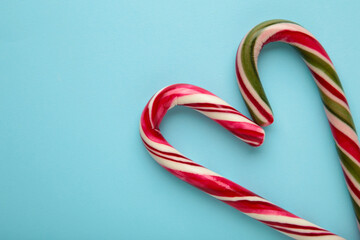 Nice christmas candy heart on blue background. Space for text