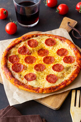 Pizza with pepperoni and cheese. Fast food. Italian cuisine. American food.