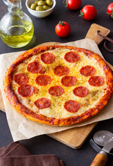 Pizza with pepperoni and cheese. Fast food. Italian cuisine. American food.