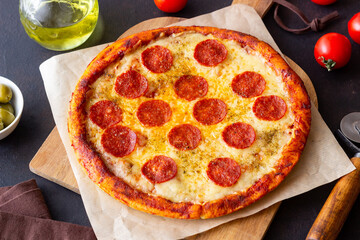 Pizza with pepperoni and cheese. Fast food. Italian cuisine. American food.