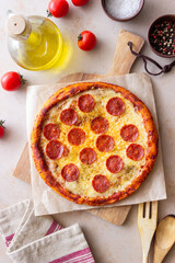 Pizza with pepperoni and cheese. Fast food. Italian cuisine. American food.