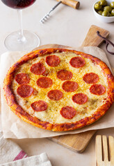 Pizza with pepperoni and cheese. Fast food. Italian cuisine. American food.
