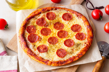 Pizza with pepperoni and cheese. Fast food. Italian cuisine. American food.