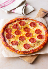 Pizza with pepperoni and cheese. Fast food. Italian cuisine. American food.