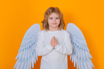 Valentine angel with prayer hands, hope and pray concept. Little cupid child. Kid angel with angels...