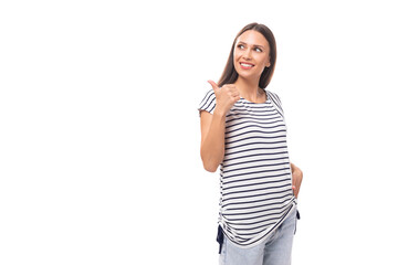 A 30-year-old brunette model woman dressed in a striped T-shirt actively gesticulates towards the...