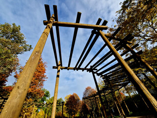 the high structure of the pergola turns into a circle, in the middle there is a sandpit for...