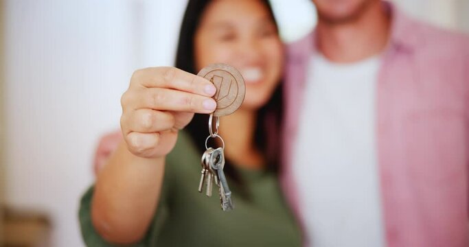 Couple, hands and keys to new house for moving, real estate investment and security for future. Closeup of people celebrate key for residential building, home and property finance for mortgage loan