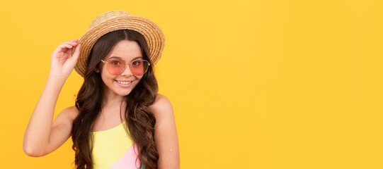 cheerful teen girl with curly hair on yellow background. happy childrens day. Child face, horizontal poster, teenager girl isolated portrait, banner with copy space.