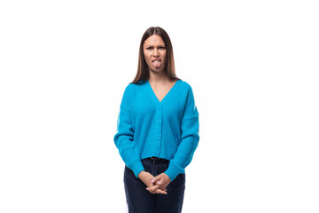 young surprised charming brunette lady dressed in blue blouse with v-neck on white background with...