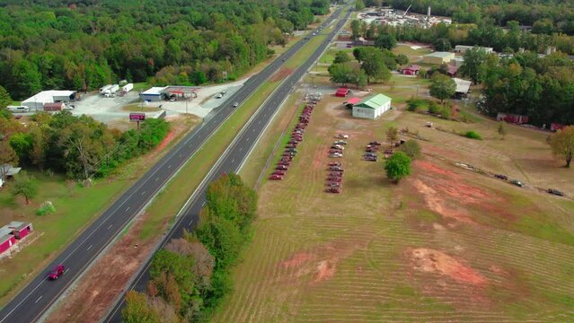 Cars and JB Hunt cargo transportation truck on interstate highway 85 i-85 road in Alabama - old cars buried, Sylacauga, AL
