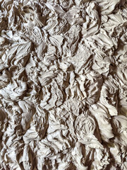 Top down full frame image of wet clay for ceramics 