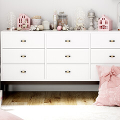 Festive pink pillow and white dresser in pink and white colors