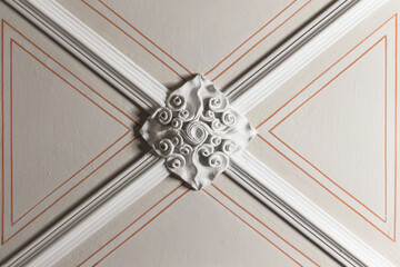 White gypsum bas-relief ceiling design. Gothic style