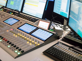 Technical room with audio mixing console and studio equipment in recording, broadcasting, editing...