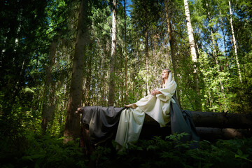 Beautiful seductive dryad. Pagan spirit of the forest. Portrait of beautiful dryad. Fairy who loves...