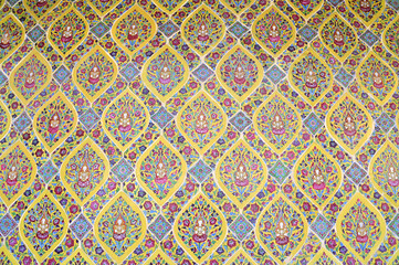 BANGKOK, THAILAND - November 10, 2023 : Golden Thai Ornament Background on Colorful Thai Temple wall at Thai Buddhist Temple, Thailand.