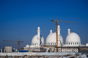 New white mosque under construction for the Muslim faith in Kazakhstan in Shymkent