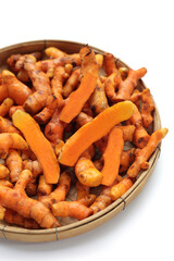 Turmeric roots on white background.