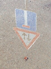 Road signs reflection in a puddle