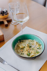 Tasty Mussels in cheese sauce with dumplings served with greens. Restaurant menu