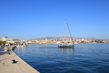 Fototapeta na wymiar View of the embankment in the old town and yacht in Split, Dalmatia, Croatia
