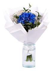 A bouquet of flowers in a vase. Hydrangea flowers. Blue flowers on a white background.