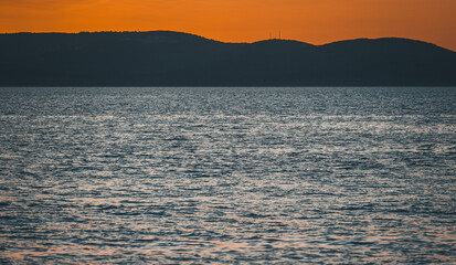 Colorful sunset on seaside. Beautiful dusk on summer resort in Croatia