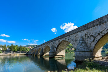 Visegrad, Bosnia and Herzegovina - August 13, 2023: Famous bridge on the Drina in Visegrad, Bosnia and Herzegovina. Mehmed Pasa Sokolovic Bridge on Drina River