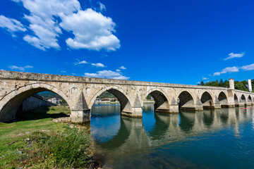 Visegrad, Bosnia and Herzegovina - August 13, 2023: Famous bridge on the Drina in Visegrad, Bosnia and Herzegovina. Mehmed Pasa Sokolovic Bridge on Drina River