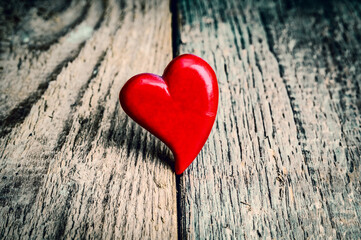 Fototapeta premium Heart on grunge wooden background. Valentines day card