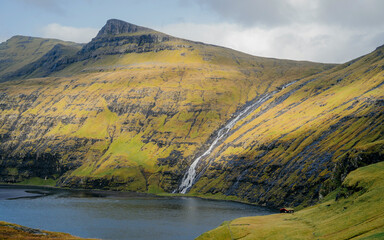 The ´lagoon seen from Saksun on Streymoy Island, Faroe Islands. The Waterfalls is filling the small lake.