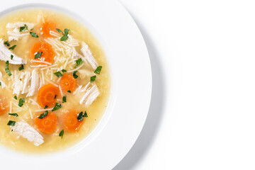 Chicken soup with vegetables isolated on white background. Copy space
